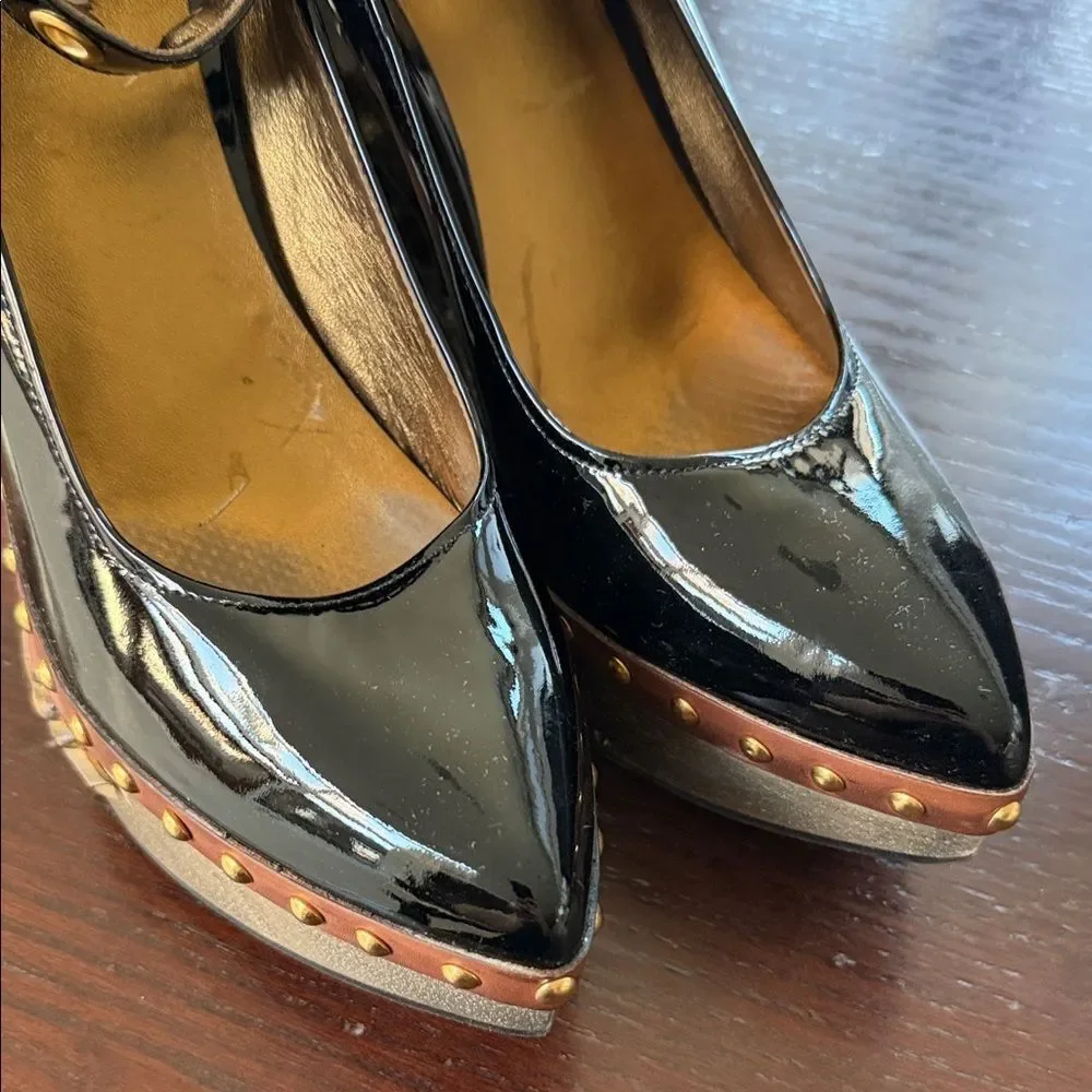 Miu Miu Black Heels with Sculpted Gold Accents